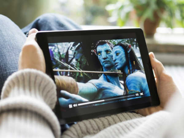 create moving stories for the most success with video marketing. this image is a pic of someone watching Avatar on a tablet